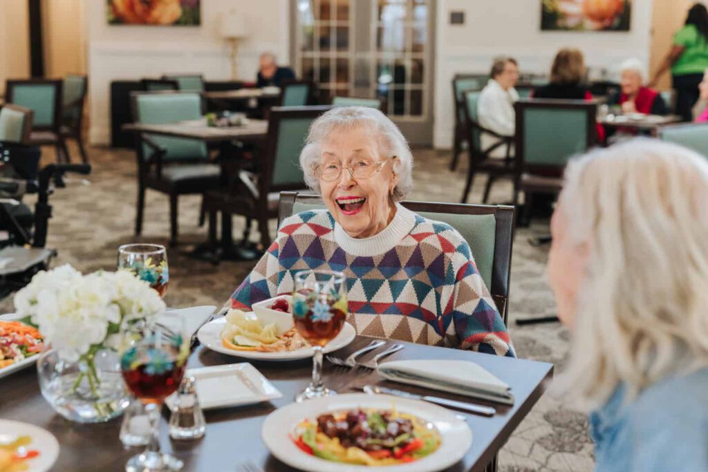 Senior woman seated at table